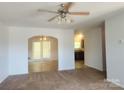 Spacious living room leading to the dining room with carpeted floors at 121 Marcella Dr, Kings Mountain, NC 28086