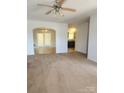 Spacious living room leading to the dining room with carpeted floors at 121 Marcella Dr, Kings Mountain, NC 28086