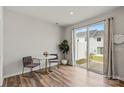 Bright dining area features wood floors and sliding glass doors to the backyard at 15622 Little Bluestem St, Charlotte, NC 28278