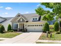 Beautifully landscaped home with manicured lawn and a two-car garage in a desirable neighborhood at 199 Blossom Ridge Dr, Mooresville, NC 28117