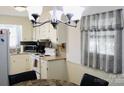 Bright eat-in kitchen featuring white cabinets, modern appliances, and stone table at 200 Elizabeth Ave # 1, Monroe, NC 28112