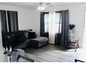 Cozy living room with hardwood floors, lots of natural light and modern decor at 200 Elizabeth Ave # 1, Monroe, NC 28112