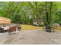 Spacious patio with stylish outdoor seating, perfect for entertaining in the serene backyard at 2009 Edgewater Dr, Charlotte, NC 28210