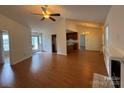 Open-concept living area features hardwood floors, high ceilings, with easy access to kitchen and backyard at 2504 Faircroft Way, Monroe, NC 28110