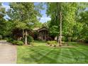 Lovely home surrounded by lush greenery and landscaping, featuring a well-manicured lawn at 2915 Cutter Ct, Waxhaw, NC 28173