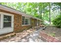 Exterior of brick home with charming front entry and garden beds at 316 Anne Ave, Waxhaw, NC 28173