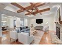 Spacious living room featuring coffered ceilings, hardwood floors, and stylish decor at 809 Verney Ln, Charlotte, NC 28226