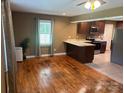 Inviting living room connected to the kitchen with beautiful hardwood floors and ample natural light at 907 Mcgowan Rd, Shelby, NC 28150