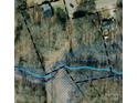 Aerial view illustrating the property's layout with woodland and boundaries, showcasing its unique features at 910 Mcgowan Rd, Shelby, NC 28150