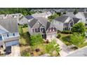 A birds-eye view of a two-story home featuring an attached garage and situated in a friendly neighborhood at 11014 Aspen Ridge Nw Ln, Concord, NC 28027