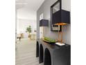 Hallway featuring a decorative console table with modern lamps and a view into a bright, inviting living space at 11128 Cardinal Creek Ave, Charlotte, NC 28215