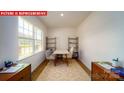 Well-lit office with modern decor, built-in shelving, and comfortable seating at 11128 Cardinal Creek Ave, Charlotte, NC 28215