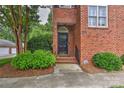 Charming brick home featuring a classic black front door with landscaped greenery at 1142 Ardwyck Pl # 5, Rock Hill, SC 29730