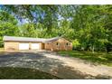 Brick home with a two-car garage, set on a lot with mature trees along the edge of the lawn at 1491 Cedar Grove Rd, Clover, SC 29710