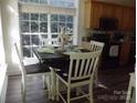 Cozy dining area with large window and place settings on the table at 1502 Mulberry Ridge Dr # 1, Newton, NC 28658