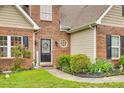 Close-up of the home's front entrance featuring a decorative door and landscaping at 1835 Montague Rd, Clover, SC 29710