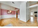 Open-concept living room showcasing hardwood floors and large entryways at 1835 Montague Rd, Clover, SC 29710
