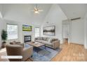 Bright living room features a fireplace, vaulted ceiling, and large windows for ample natural light at 1835 Montague Rd, Clover, SC 29710