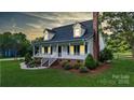 Charming two-story home with a welcoming front porch and beautifully landscaped front yard at 1920 Williford Woods Ln # 5, Rock Hill, SC 29730