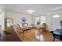 Cozy living room featuring hardwood floors, ornate furniture, and bright natural light at 324 Autumn Dr, Harrisburg, NC 28075
