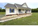 Attractive single-story home with blue shutters and a well-maintained lawn at 3300 Luke Ct, Monroe, NC 28112