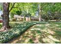 Traditional home with a well-kept lawn, mature trees, and green accents at 415 Princeton Dr, Salisbury, NC 28144