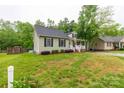 Well-maintained home with a manicured lawn, mature trees, and inviting curb appeal at 522 Kittiewake Ln, Clover, SC 29710