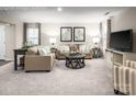 Inviting living room with neutral tones, stylish furnishings, and ample natural light at 5220 Mccallum Meadows Dr, Charlotte, NC 28216