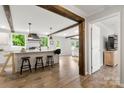 Open kitchen featuring wood beams, a large island, and an open layout at 5528 Little Mountain Rd, Gastonia, NC 28056