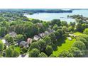 Picturesque aerial view showcasing the lakeside community and the sparkling water, creating a serene and inviting atmosphere at 7814 Knox Ridge Rd, Huntersville, NC 28078