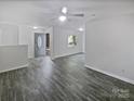 Bright living room with ample natural light, modern flooring, and a welcoming entrance at 8600 Eaglewind Dr, Charlotte, NC 28212