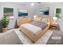 Serene main bedroom featuring neutral tones, soft lighting, and stylish decor for a relaxing retreat at 8600 Eaglewind Dr, Charlotte, NC 28212