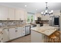 Modern kitchen featuring an island, stainless steel appliances, and granite countertops at 895 Furnace Rd, Iron Station, NC 28080