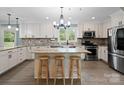 Modern kitchen featuring an island, stainless steel appliances, and granite countertops at 895 Furnace Rd, Iron Station, NC 28080