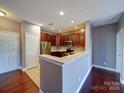 Well-lit kitchen with stainless appliances, granite counters, and ample cabinet space at 1000 E Woodlawn Rd # 402, Charlotte, NC 28209