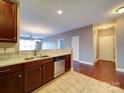 Modern kitchen featuring stainless steel appliances, granite countertops, and stylish cabinetry at 1000 E Woodlawn Rd # 402, Charlotte, NC 28209
