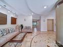 Inviting lobby boasts tiled flooring and comfortable seating near elevator access, creating a welcoming atmosphere at 1000 E Woodlawn Rd # 402, Charlotte, NC 28209