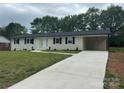 Beautifully renovated painted brick home with a convenient carport and a new driveway at 117 Woodland Ave, Shelby, NC 28152