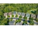 An aerial perspective of the neighborhood showcasing well-maintained homes and lush greenery at 1365 Winged Foot Dr, Denver, NC 28037