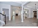 Bright and airy living room featuring hardwood floors, a fireplace, and an open layout at 1365 Winged Foot Dr, Denver, NC 28037