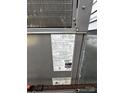 Close-up of HVAC unit with label and model number at 3048 Marigold Ln, Gastonia, NC 28052