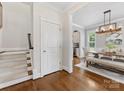 Bright dining room view with hardwood floors and stylish furniture, with access to other rooms at 3101 Auburn Ave, Charlotte, NC 28209