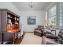 Comfortable office with natural light from shuttered window and hardwood floors at 376 Sensibility Cir # 8, Fort Mill, SC 29708