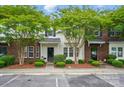 Beautiful townhome exterior with fresh landscaping and convenient parking at 4132 Kenton Glenn Nw Ct, Concord, NC 28027