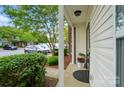 Cozy front porch with a lovely view and charming curb appeal at 4132 Kenton Glenn Nw Ct, Concord, NC 28027