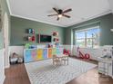 Playroom with colorful storage, a ceiling fan, and natural light at 1005 Cheviot Ct, Waxhaw, NC 28173