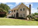 Brick two-story home featuring attached garage and manicured landscaping at 109 Arabian Ln, Salisbury, NC 28147