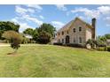 Spacious front yard with lush green grass surrounds this brick two-story house at 109 Arabian Ln, Salisbury, NC 28147