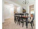 Elegant dining room featuring a chandelier, art and dark wood table perfect for Gathering dinners at 12304 Lookout Point Dr, Charlotte, NC 28269