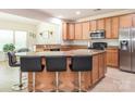 Spacious kitchen features granite countertops, stainless steel appliances, and a large island with bar seating at 12304 Lookout Point Dr, Charlotte, NC 28269